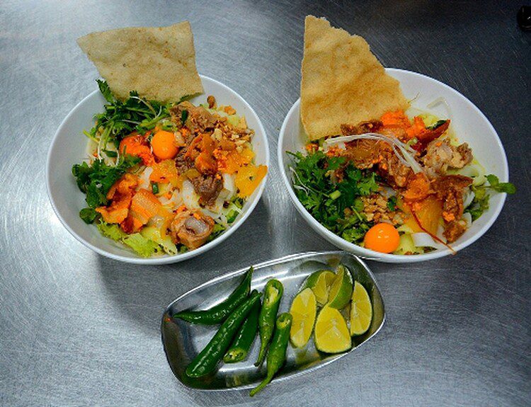 The Quang noodles have a distinct flavor. A bowl of this delicious dish contains noodles, broth, pork and fresh vegetables topped with scallion, cilantro and peanuts. The broth has the sweetness of finely crushed shrimp and the elements on this dish complement each other so well.